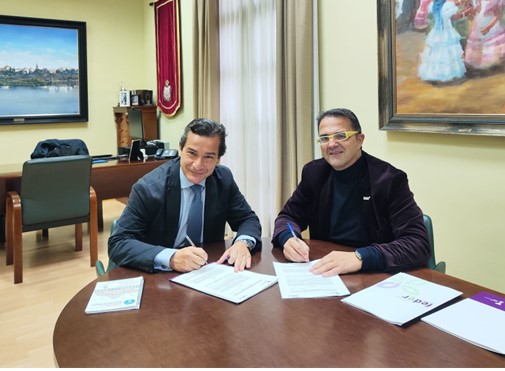 Los presidentes de ambas instituciones firmando el convenio.